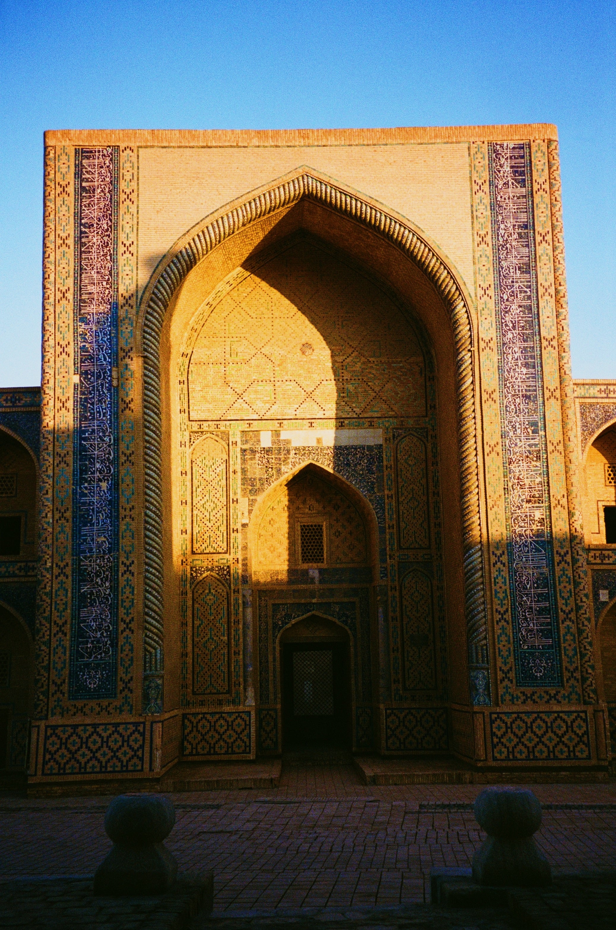 A tiled archway in warm light