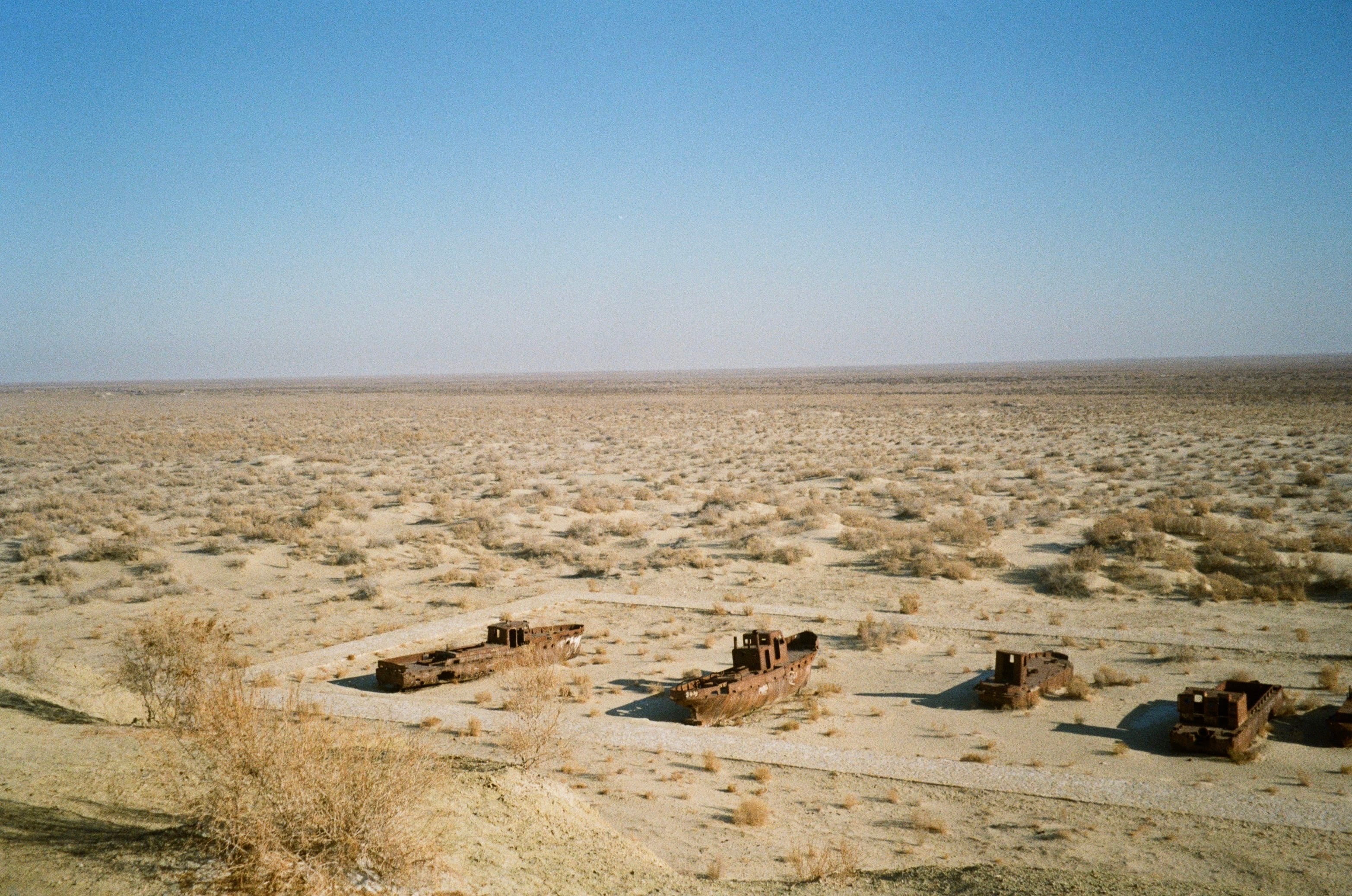 Scrubby desert flats under a pale sky
