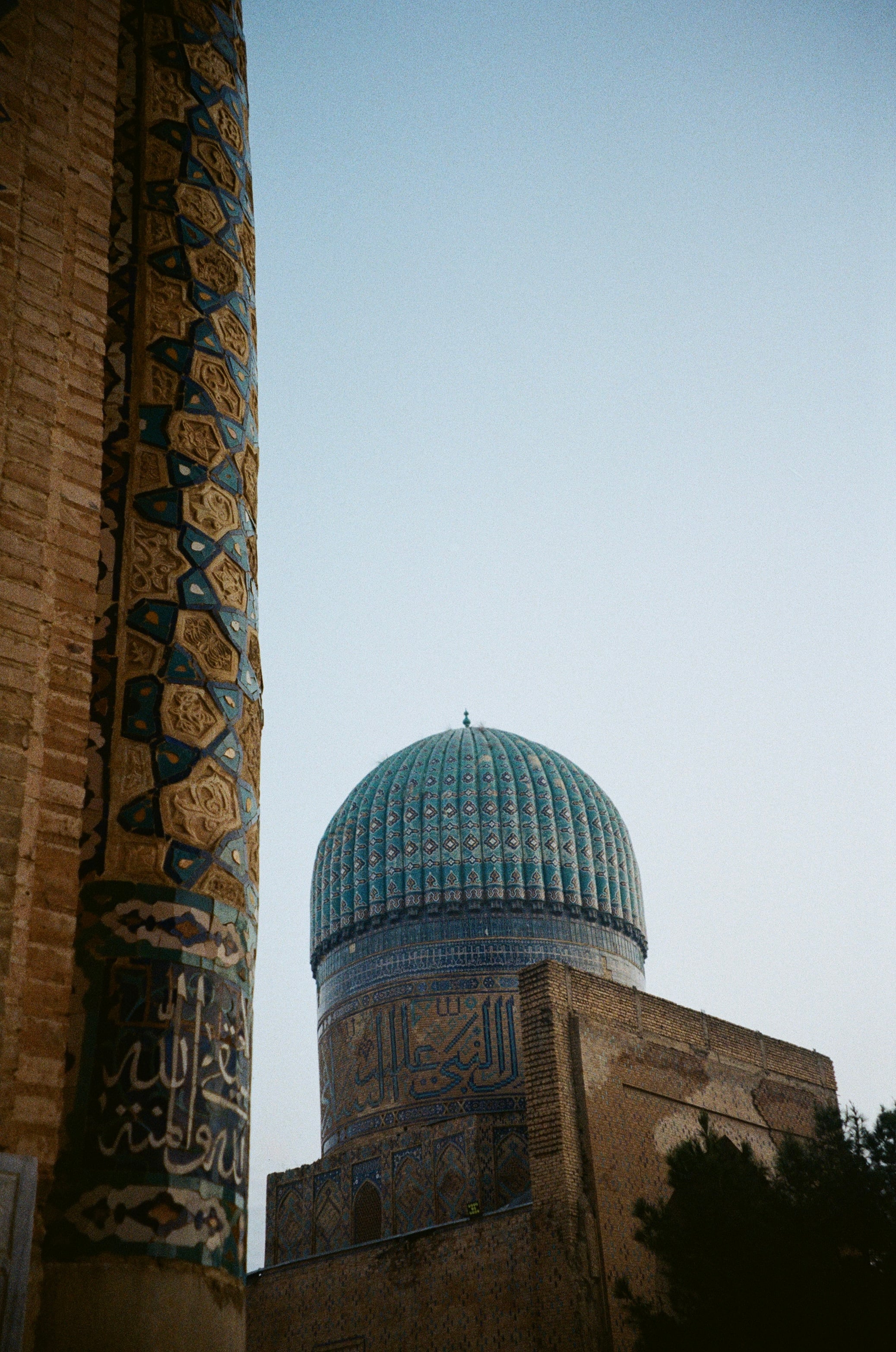 A ribbed blue dome between tall tiled walls