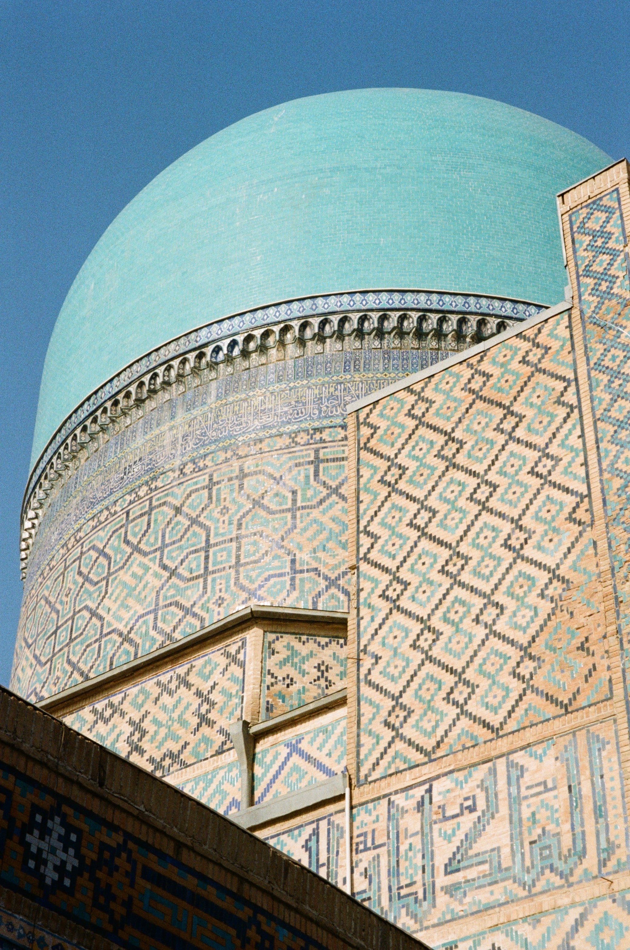 A turquoise dome above richly patterned tilework